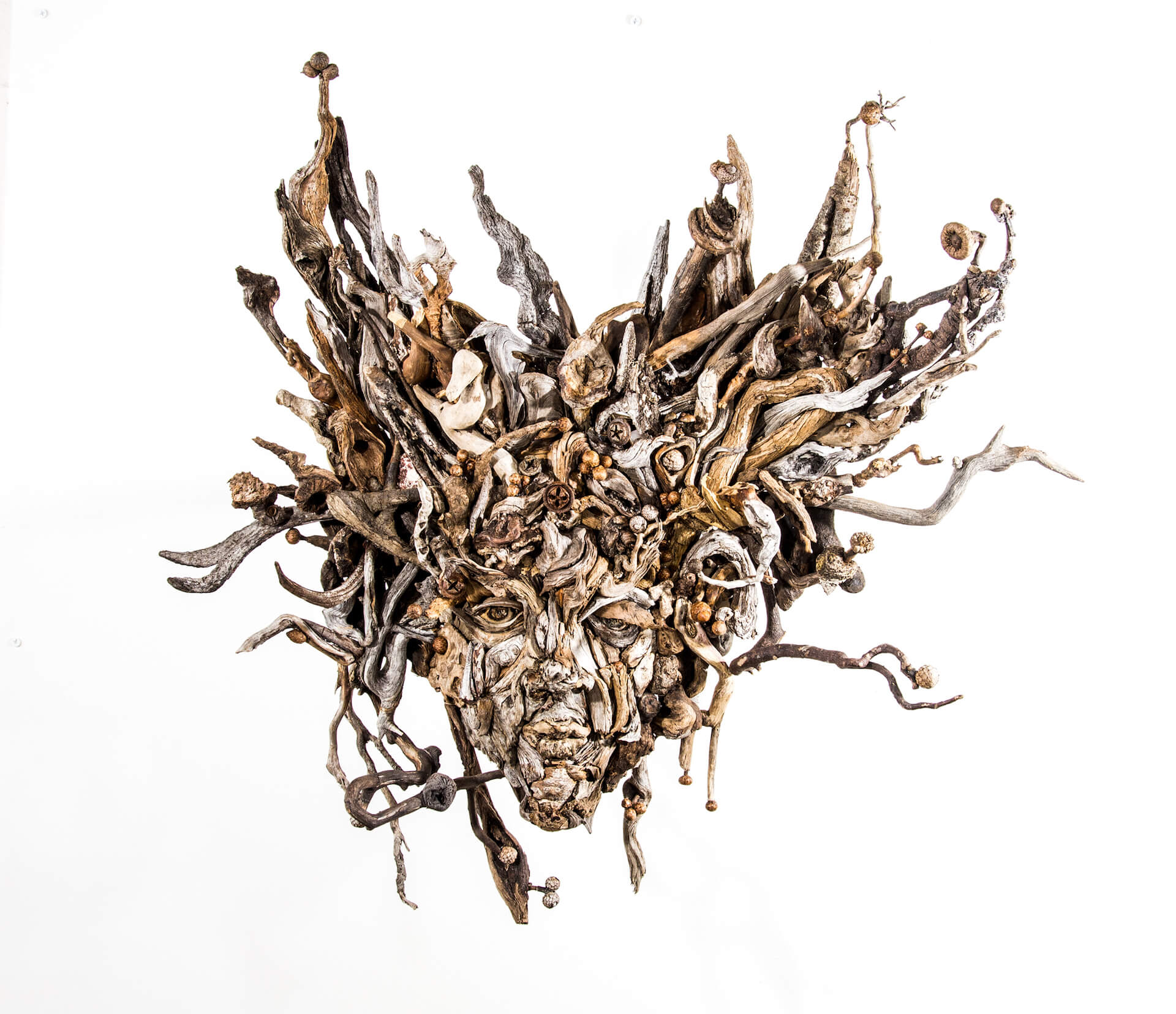 the wall hanging relief faces