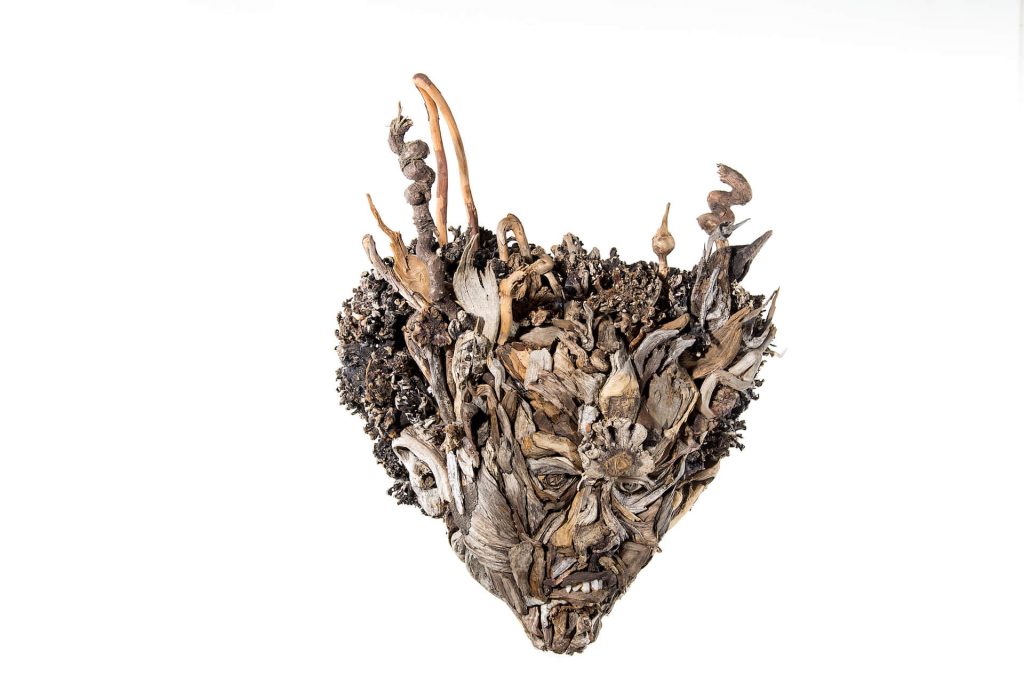 the wall hanging relief faces