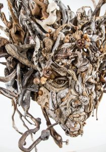 the wall hanging relief faces