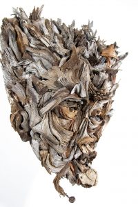 the wall hanging relief faces