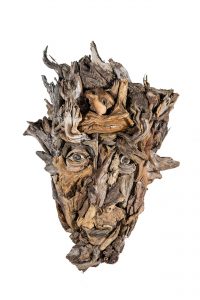 the wall hanging relief faces