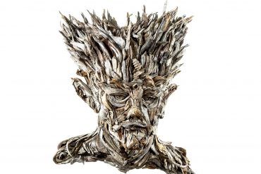 the wall hanging relief faces