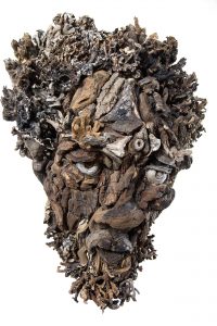 the wall hanging relief faces