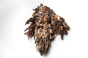 the wall hanging relief faces