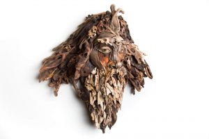 the wall hanging relief faces