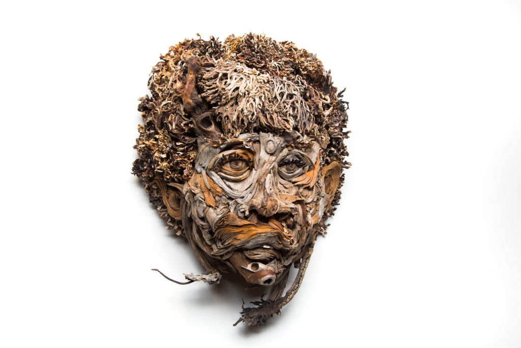 the wall hanging relief faces