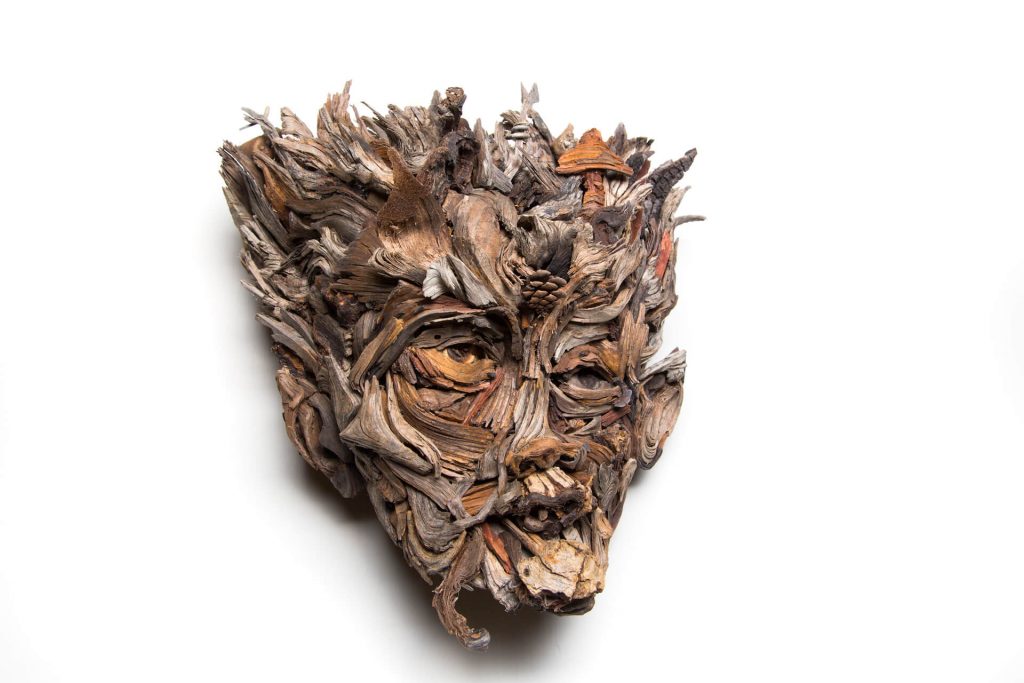 the wall hanging relief faces