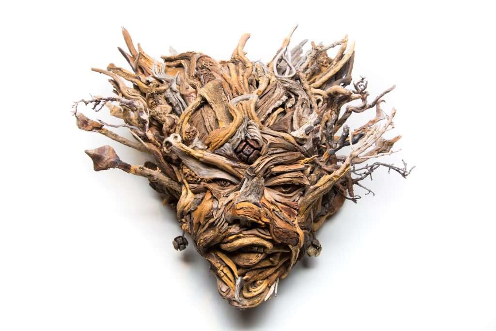 the wall hanging relief faces