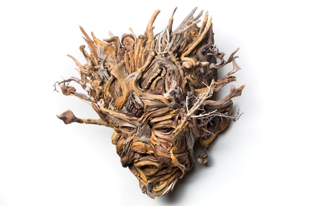 the wall hanging relief faces