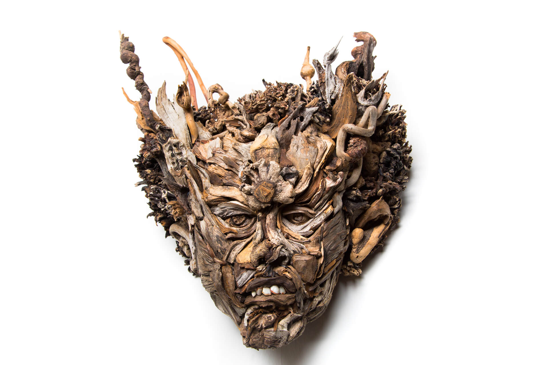 the wall hanging relief faces