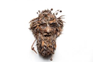 the wall hanging relief faces