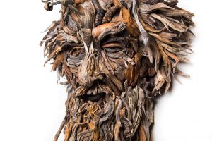 the wall hanging relief faces